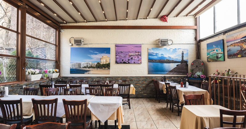 Interior, chairs and tables, paintings on the wall