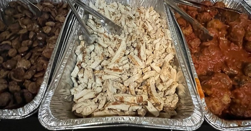 Buffet catering setup featuring various hot dishes