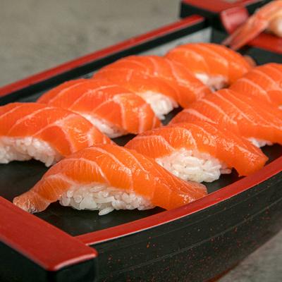 Salmon and shrimp nigiri sushi boat.