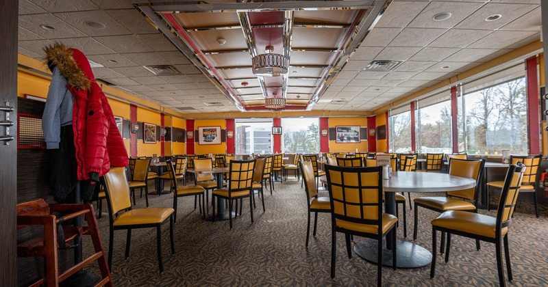 Interior, wide view of dining area, tables and chairs