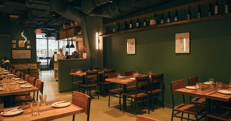 Interior, dining tables ready for guests