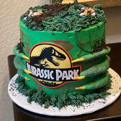 Green Jurassic Park themed cake.