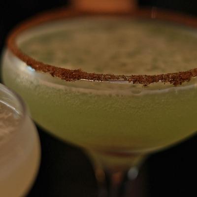 Two cocktails in coupette glasses, closeup.