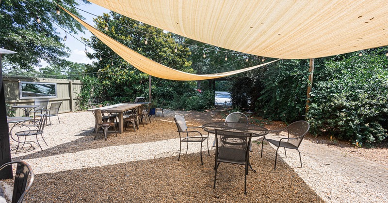 Patio, tables, chairs, sails parasols