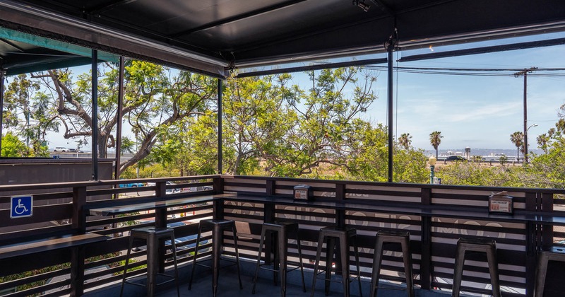 Exterior, seating place with high chairs on covered patio