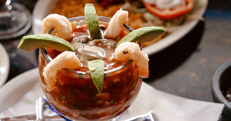Shrimp cocktail and served meals