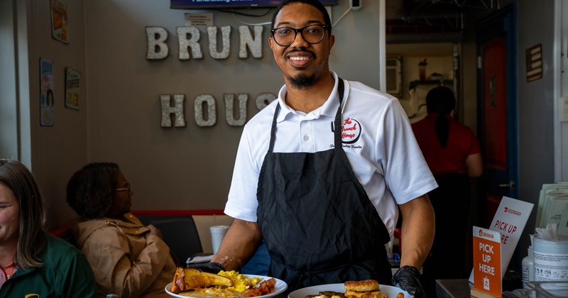 A smiling staff member