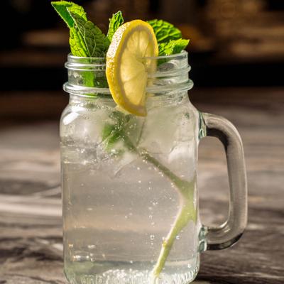 Fresh Lime Soda in a mason jar with mint and lemon garnish.