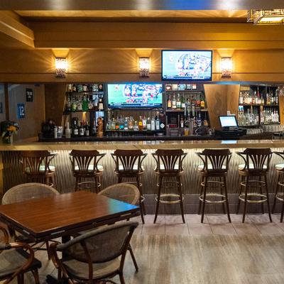 Interior, seating area and a bar.