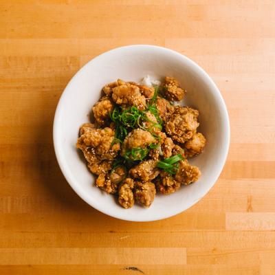 Crispy fried bites topped with herbs.