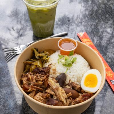 BBQ pork with rice, savory sweet sauce, Chinese sausage, cucumber, cilantro, and an egg.