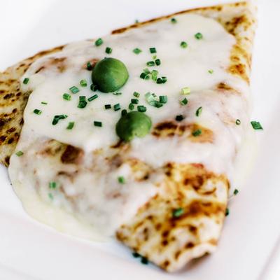 Savory crepe with melted cheese and chives.