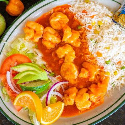 Devil's shrimp served with rice and salad.