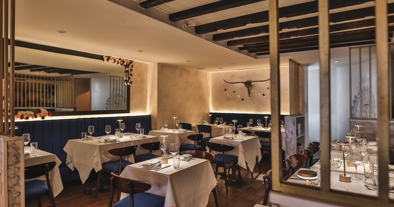 Interior, set tables and chairs ready for guests