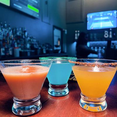 Red, blue, and orange cocktails.