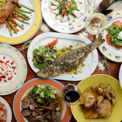 Seafood and assorted dishes spread across a table.