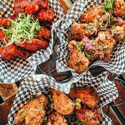 Baskets of chicken wings with different flavors ready to be enjoyed small