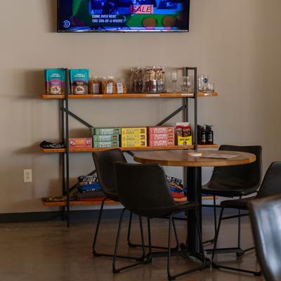 Interior, seating and shelves with snacks.