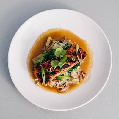 Grilled salmon with bok choy, mushrooms, soy & ginger sauce, scallions and coconut rice