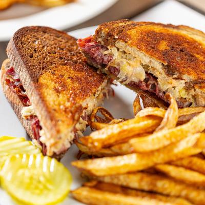 Pastrami Reuben served with fries.