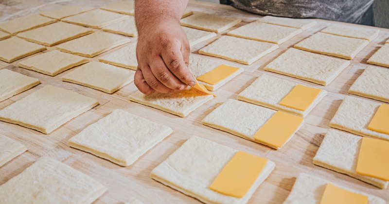 A baker preparing pastry dish