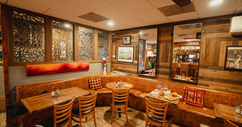 Large corner banquette bench with tables and chairs