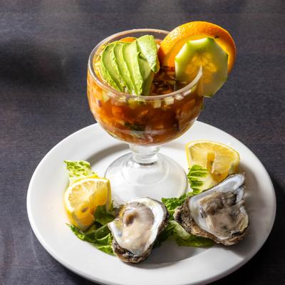 Shrimp cocktail served with oysters.