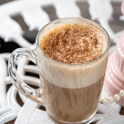 A glass mug of latte.