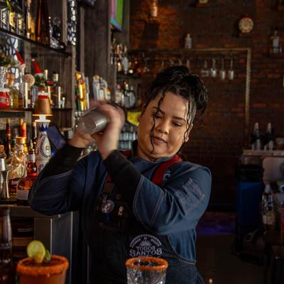 Bartender shaking a cocktail.