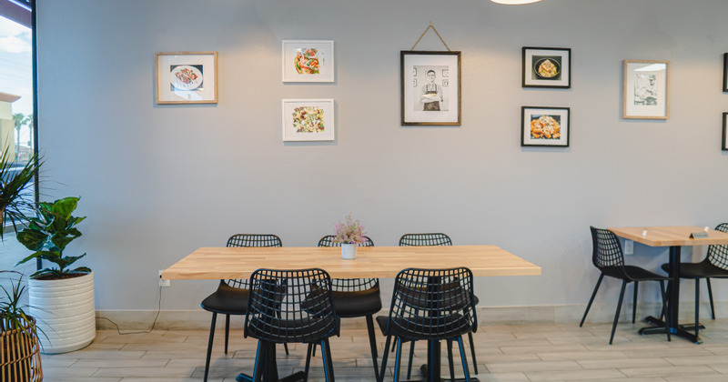 Restaurant interior - table, chairs, pictures on the wall