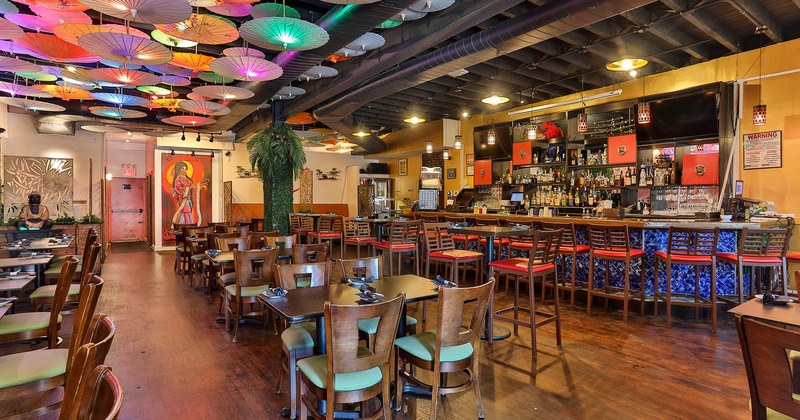 Interior space, dining area and bar, Japanese parasols hanging from the ceiling