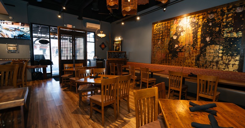 Spacious and modern interior dining area with set dining tables