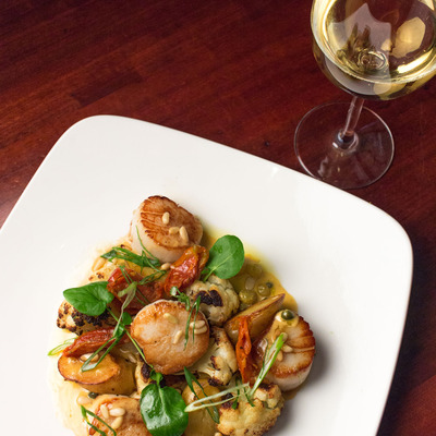 Pan seared scallops with a glass of white wine