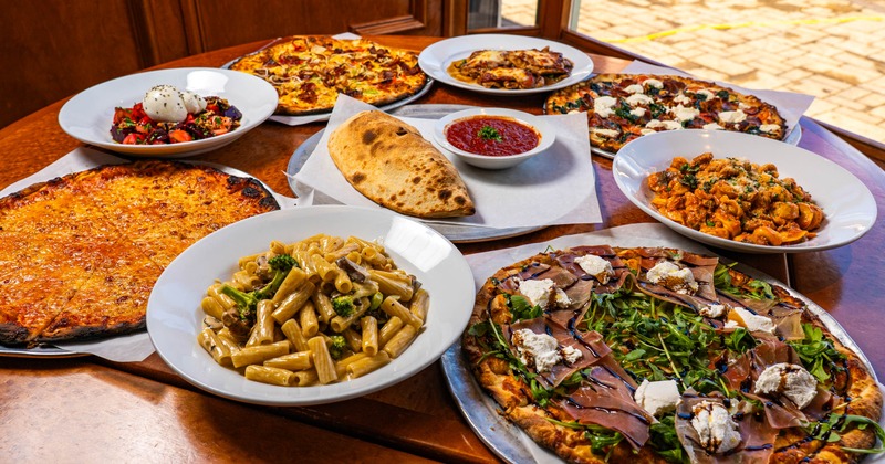 Various dishes served on the wooden table