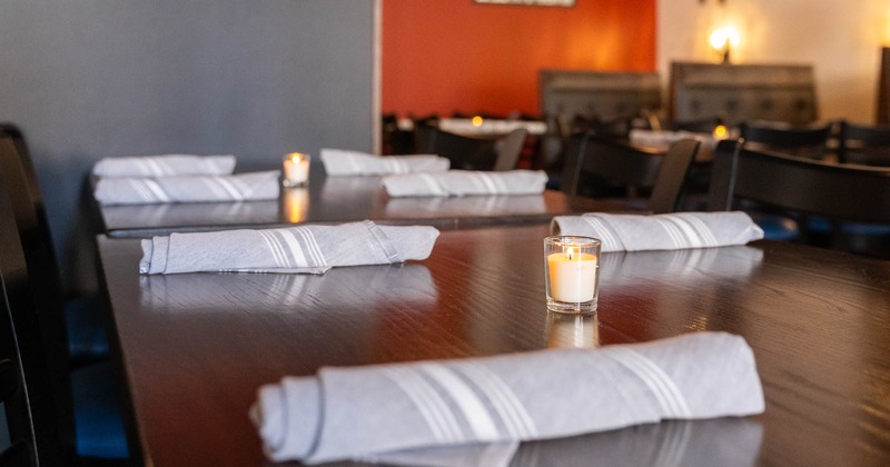 Interior, tables with tableware ready for guests