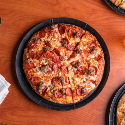 Atlas Combo Pizza with pepperoni, Italian sausage, red onions and bell peppers.