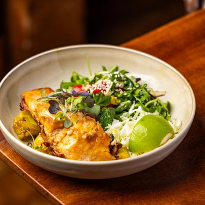 Seared Atlantic salmon served with a side salad & veggies.