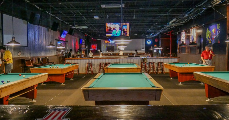 Sport bar interior space, pool tables lined up