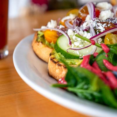 Avocado Caprese loaded toast, close up.