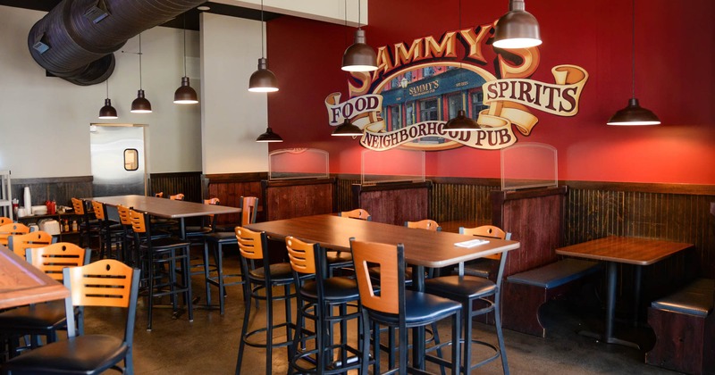 Interior, tall tables and restaurant booths