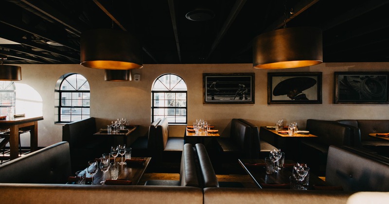A cozy restaurant interior with brown leather booths
