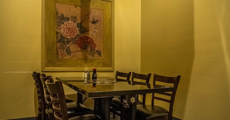 Fully set table, painting on the wall