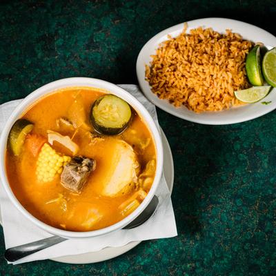 Soup with meat and vegetables, rice on the side