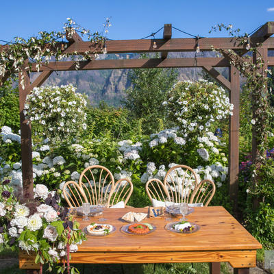 Bride and groom table with flower ornaments in the back