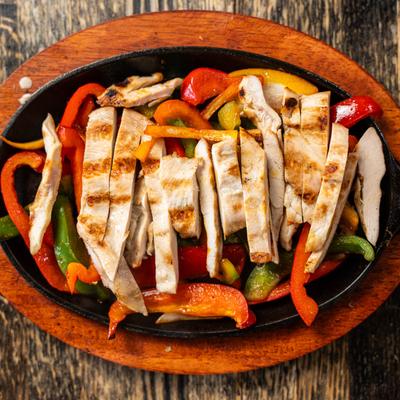 Chicken Fajitas, with onions, and green and red bell peppers.
