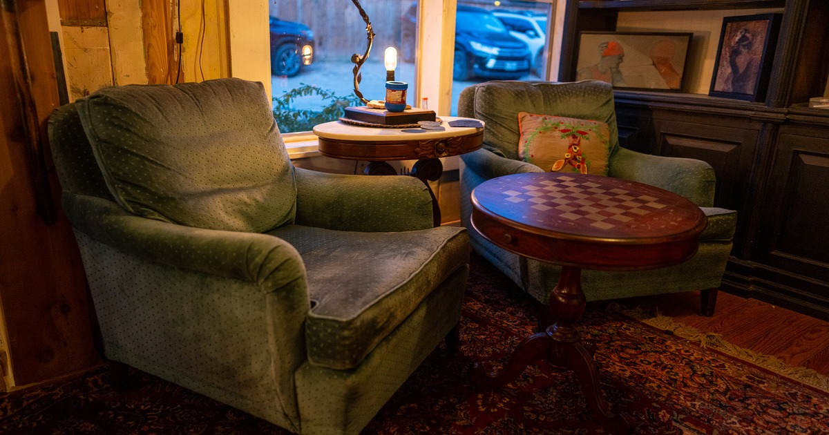 Interior, two armchairs by the window
