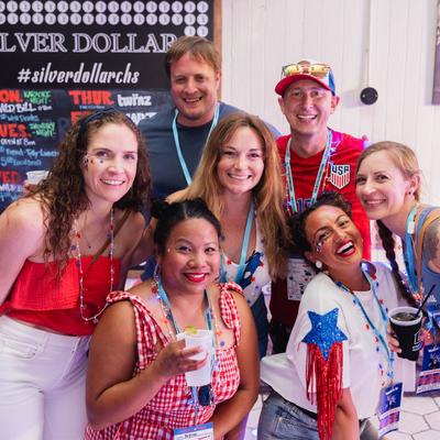 A group of cheerful people posing for a shot.