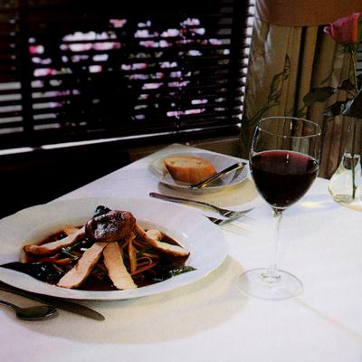 Pasta served with bread and a glass of red wine