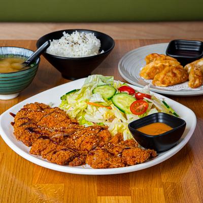 Pork cutlet served with salad.