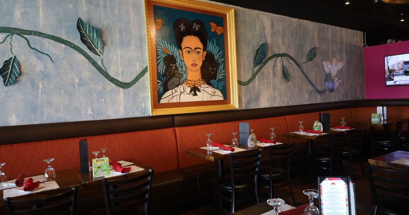 Interior, banquet seating with tables and chairs, a picture on the wall